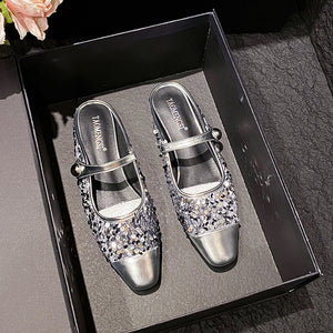 Silver sequin closed-toe Mary Jane mules in a box