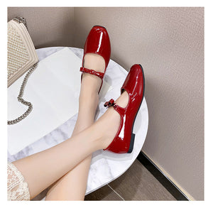Red patent bow Mary Jane ballet flats worn