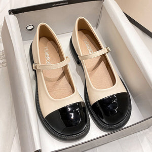 Apricot cap-toe platform Mary Jane pumps in a box