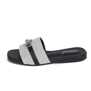 Gray double-buckle slide sandal side view on white