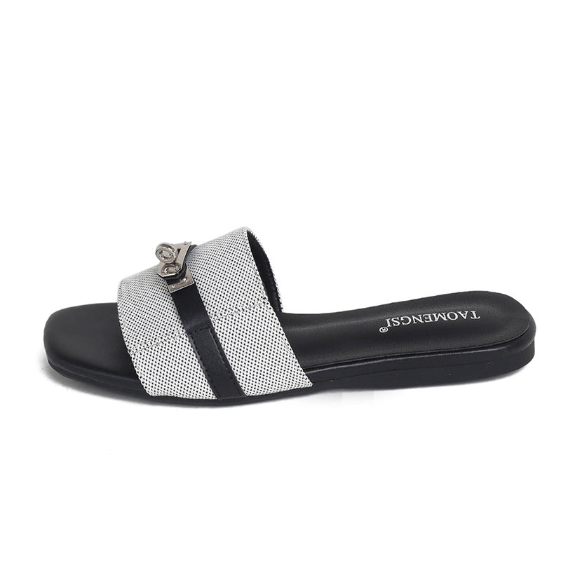 Gray double-buckle slide sandal side view on white
