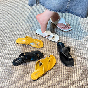 Yellow, black and white toe-post sandal color options